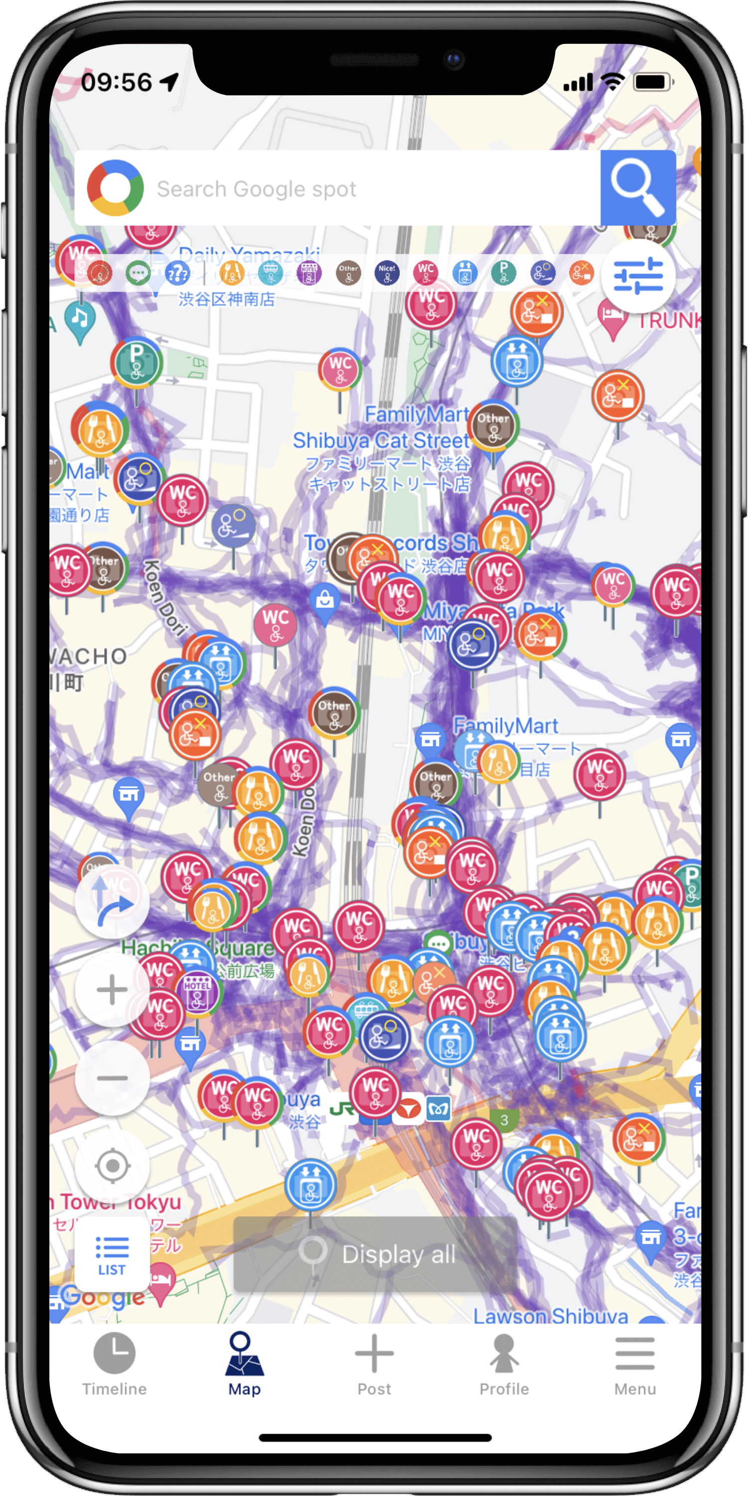 バリアフリーマップ「WheeLog!」の画面が表示されたスマートフォンの写真です。地図に車椅子に対応した施設の情報を表すカラフルなアイコンが表示されています